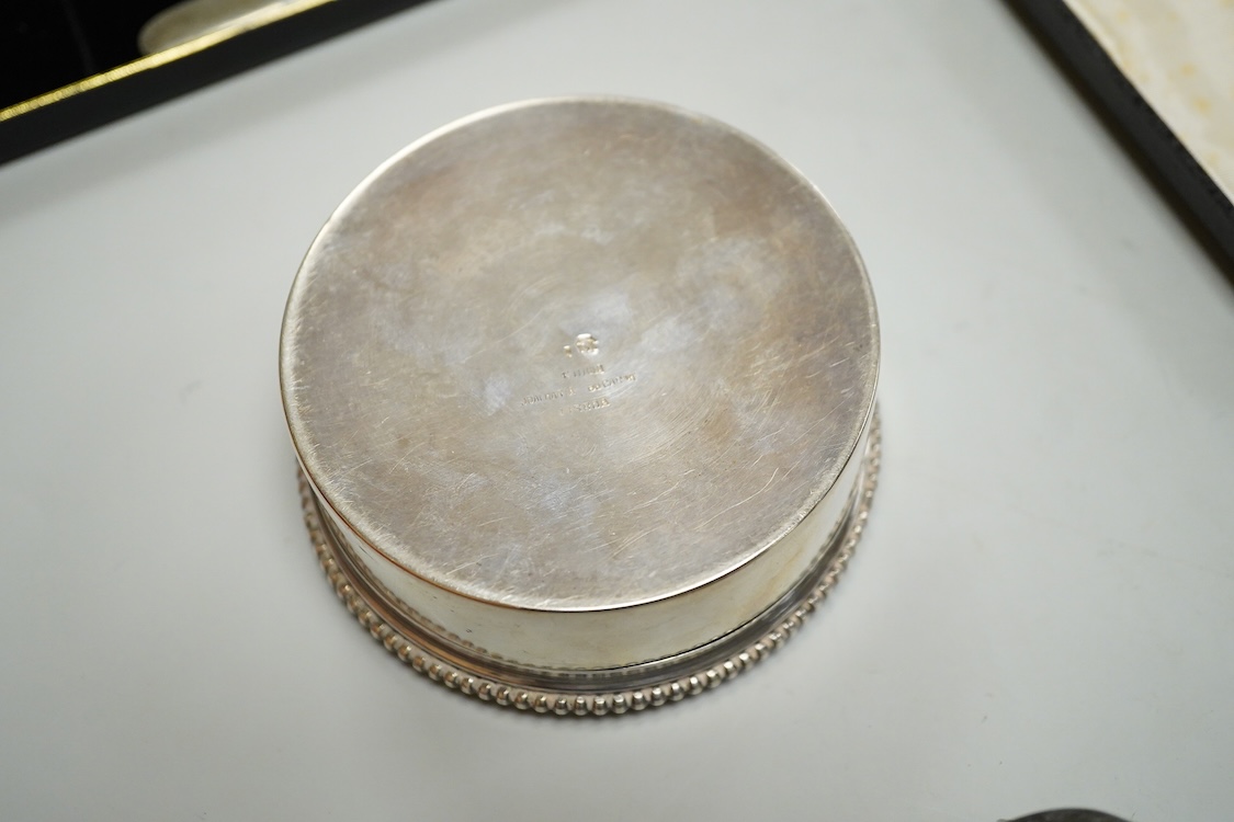 A Portuguese white metal 916 standard circular box and cover, retailed by Joalharia Do Carmo, diameter 94mm, together with cased set of six silver plated coffee spoons, a cased silver teaspoons, a Victorian silver christ